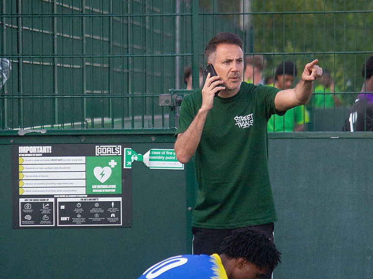 A Street Trials organiser relays player feedback from the touchline