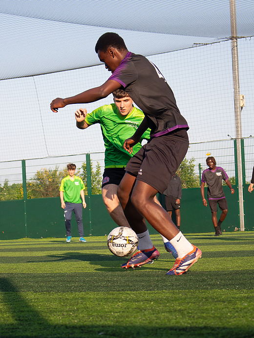 Two trialists contest a high ball during a 7-a-side Street Trials match